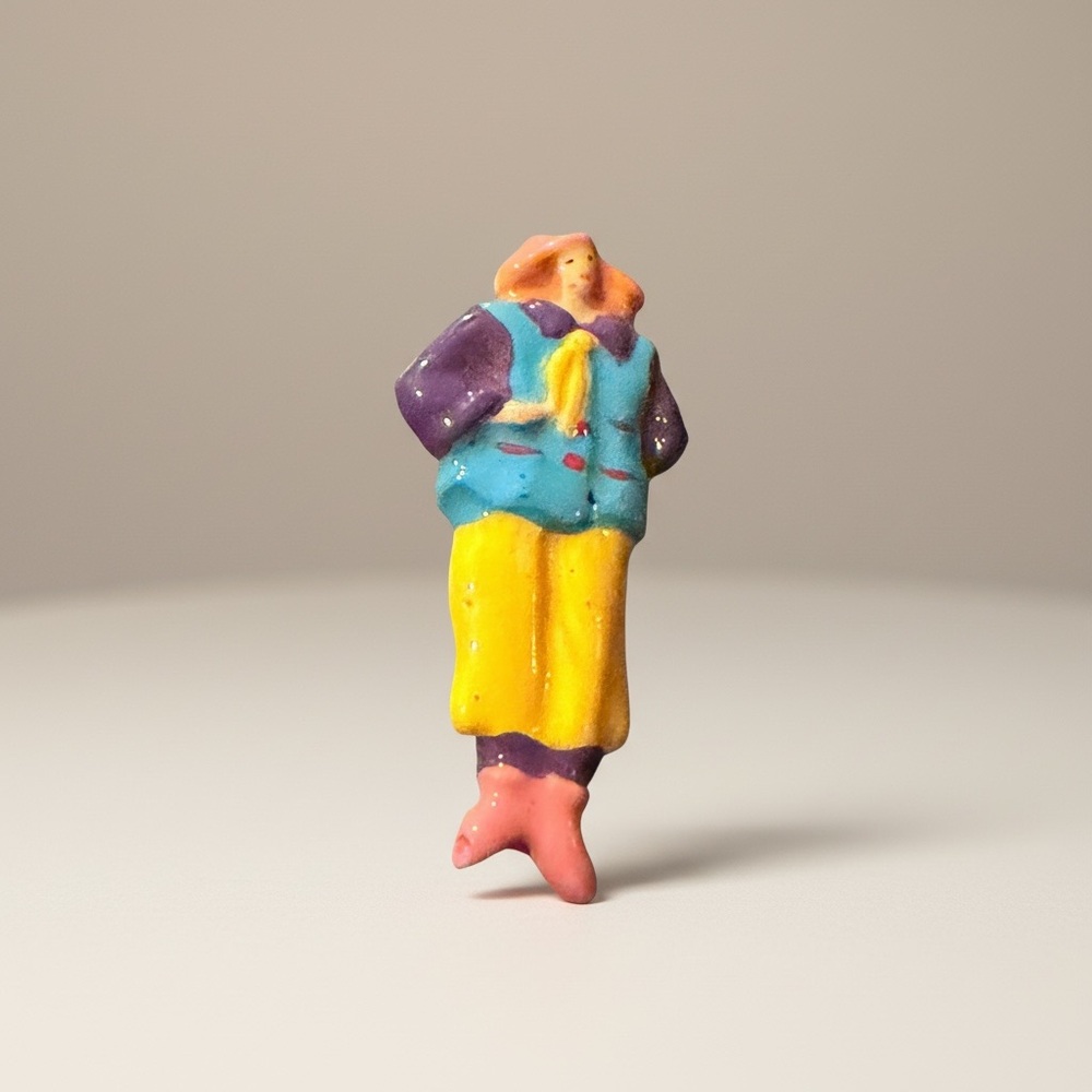 Colorful Figurine with Yellow and Purple Outfit